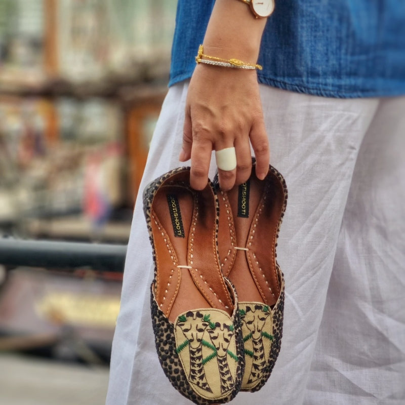 “Close-up Holidaze shoes detailing embroidery and premium leather texture, festive footwear”