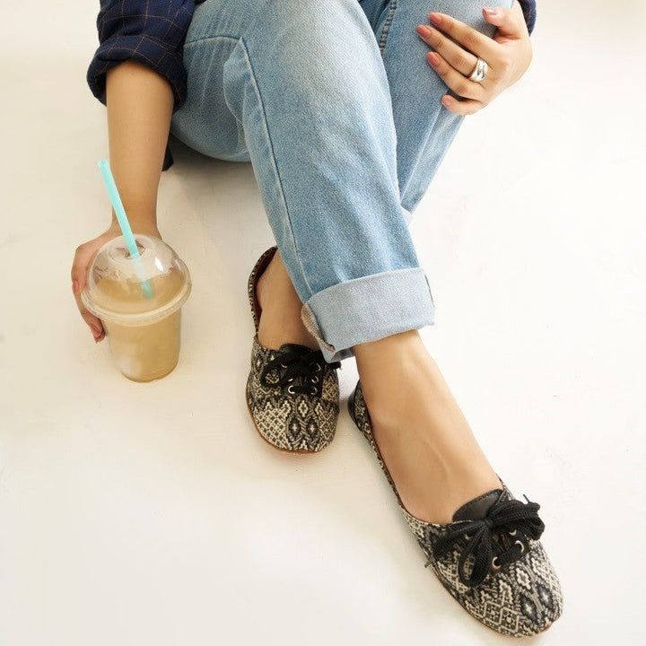 “Close-up of Whisper Weave Lace Up Khussa shoes highlighting embroidery and premium leather texture”