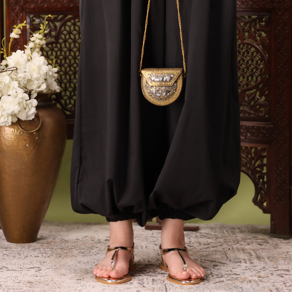 Golden sandal on a foot 
