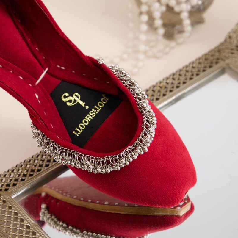“Close-up of Beaded Halo Red Khussa shoes highlighting leather texture and subtle bead accents”